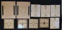 Pyrography and woodworking - Game boards created for Ysabeau of Prague's vigil at Gulf Wars 2016. Clockwise from the top row: Shove Ha'penny (2),Glückhaus (4), Nine Men's Morris (4)