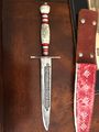 Acid-etching, scrimshaw, and leatherwork – 1991-ish. Pepin de Moronis had won this dagger from Orm Skjolbidig at his (Pepin’s) first event, and worn it ever since, and gave it to Jan at our wedding feast in honor of years of friendship.