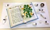 Done for the Kingdom Fiber Arts Event, held in Eldern Hills, June 2018. In keeping with the theme, it showed a book open to an illustration of Vegetable Sheep. The picture is taken from a period illustration; the text was written by me to explain why the sheep were escaping and running around. Materials: Book = Cake covered by fondant, with lettering and illustration applied with edible markers. (I was making this on the road, don’t judge). Plant and flowers = colored fondant. Spindle and stick = piped melting candies. Thread = fondant. Sheep = faces are piped melting candies, bodies are cotton candy. This was my first and LAST time using cotton candy; it absorbs moisture from the air and the sheep melted into little flat things within 30 minutes.